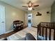 Cozy Bedroom with wood floors, ceiling fan and changing table at 3520 Lantern Ln, Columbus, IN 47203