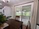 Bright dining area with sliding glass doors to a patio, features hardwood floors and modern decor at 3520 Lantern Ln, Columbus, IN 47203