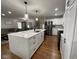 Spacious kitchen with stainless steel appliances, granite countertops and a large center island at 3520 Lantern Ln, Columbus, IN 47203