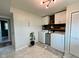 Bright laundry room featuring modern machines, ample storage, and a stylish, decorative plant at 3520 Lantern Ln, Columbus, IN 47203