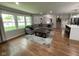 Inviting living room showcasing hardwood floors, large windows, and comfortable seating at 3520 Lantern Ln, Columbus, IN 47203