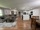 Open-concept design featuring a living room, dining area, and modern kitchen at 3520 Lantern Ln, Columbus, IN 47203