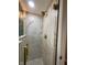 Close up of the luxurious shower features gold fixtures and pristine marble and white tile at 3520 Lantern Ln, Columbus, IN 47203