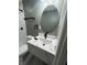 This remodeled bathroom offers an elegant floating vanity with a modern faucet at 3949 Chateau Dr, Indianapolis, IN 46226
