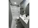 This bathroom features a shower, modern vanity, and stylish fixtures at 3949 Chateau Dr, Indianapolis, IN 46226