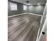 Bright gray bedroom featuring recessed lighting, windows and wide-plank flooring at 3949 Chateau Dr, Indianapolis, IN 46226