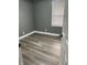 Bedroom with gray walls, white trim, and wood floors at 3949 Chateau Dr, Indianapolis, IN 46226