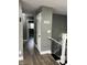 Hallway with wood floors, gray walls, and white trim at 3949 Chateau Dr, Indianapolis, IN 46226