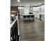 Bright kitchen with an island and white cabinetry, stainless steel appliances, and hardwood floors at 3949 Chateau Dr, Indianapolis, IN 46226