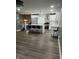 Open-concept kitchen features a center island, stainless steel appliances, and modern lighting at 3949 Chateau Dr, Indianapolis, IN 46226