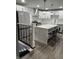 Spacious kitchen with a center island, stainless steel appliances, and modern lighting at 3949 Chateau Dr, Indianapolis, IN 46226