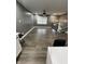 Open floor plan living room featuring modern lighting, grey walls, and wood floors at 3949 Chateau Dr, Indianapolis, IN 46226