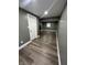 Large room with gray walls, wood-look flooring and recessed lighting at 3949 Chateau Dr, Indianapolis, IN 46226