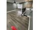 Open floor plan living room featuring modern lighting, grey walls, and wood floors at 3949 Chateau Dr, Indianapolis, IN 46226