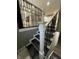 Modern staircase featuring decorative metal railing and gray color palette at 3949 Chateau Dr, Indianapolis, IN 46226