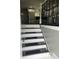 View of staircase leading to a modern kitchen featuring white cabinetry and stainless steel appliances at 3949 Chateau Dr, Indianapolis, IN 46226