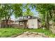 Charming home featuring a fenced backyard with a small deck and patio, ideal for outdoor living at 4048 N College Ave, Indianapolis, IN 46205