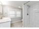 Updated bathroom featuring stylish vanity with sink and a separate shower with tile at 4048 N College Ave, Indianapolis, IN 46205