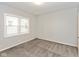 Bright bedroom featuring a large window and plush carpeting at 4048 N College Ave, Indianapolis, IN 46205