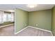 Bedroom showcasing neutral carpet, a split design and natural light from the window, creating a bright space at 4048 N College Ave, Indianapolis, IN 46205
