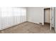 Well-lit bedroom with plush carpet and a window, creating a cozy and inviting space at 4048 N College Ave, Indianapolis, IN 46205
