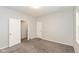 Spacious bedroom with neutral carpet and multiple doors for easy access at 4048 N College Ave, Indianapolis, IN 46205