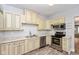 Modern kitchen with stainless steel appliances and ample cabinet space at 4048 N College Ave, Indianapolis, IN 46205