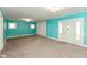 Bright and spacious living room with a neutral carpet and large windows at 4048 N College Ave, Indianapolis, IN 46205