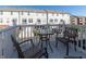 Relaxing balcony featuring outdoor seating with a glass table and chairs, offering a pleasant outdoor space at 420 Beverly Ct, Carmel, IN 46032