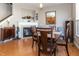 Dining area with fireplace, wooden table, and view into another room at 420 Beverly Ct, Carmel, IN 46032