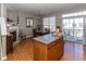 Bright dining area featuring wood floors, a fireplace, and access to a deck at 420 Beverly Ct, Carmel, IN 46032