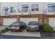 Townhome exterior featuring a two-car garage and second-story balcony at 420 Beverly Ct, Carmel, IN 46032