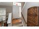 Welcoming foyer featuring hardwood floors, a white front door, and staircase with carpet at 420 Beverly Ct, Carmel, IN 46032