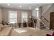 Relaxing living room space with carpet, neutral paint, and ample sunlight from windows at 420 Beverly Ct, Carmel, IN 46032