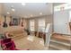 Cozy living room with carpet, comfortable seating, and natural light from the windows at 420 Beverly Ct, Carmel, IN 46032