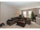 Comfortable living room featuring a sectional sofa, area rug, and bright windows at 420 Beverly Ct, Carmel, IN 46032