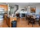 Open-concept living room and dining area with fireplace and wood flooring at 420 Beverly Ct, Carmel, IN 46032