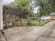 Outdoor patio area with pergola, fenced yard, and additional outbuilding adds charm to this lovely home at 4455 Central Ave, Indianapolis, IN 46205