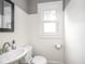 Bathroom featuring white beadboard and fixtures at 4455 Central Ave, Indianapolis, IN 46205