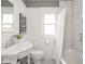 Bathroom featuring updated fixtures and a tiled shower, offering a relaxing experience at 4455 Central Ave, Indianapolis, IN 46205