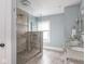 Bathroom featuring a glass shower, double vanity, and updated fixtures, offering a luxurious experience at 4455 Central Ave, Indianapolis, IN 46205