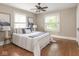 Bright bedroom with hardwood floors, natural light, and a cozy, inviting atmosphere at 4455 Central Ave, Indianapolis, IN 46205