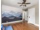 Bedroom with hardwood floors and mural at 4455 Central Ave, Indianapolis, IN 46205