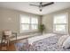 Bedroom with hardwood floors, two windows, and light walls at 4455 Central Ave, Indianapolis, IN 46205