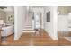 Inviting foyer featuring hardwood floors, staircase, and access to living areas at 4455 Central Ave, Indianapolis, IN 46205
