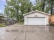Detached garage with ample parking space and a basketball hoop, adding convenience and recreation at 4455 Central Ave, Indianapolis, IN 46205