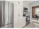 Modern kitchen featuring stainless steel appliances, white cabinetry, and granite countertops at 4455 Central Ave, Indianapolis, IN 46205
