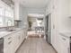 Bright kitchen with white cabinets, granite countertops, and stainless-steel appliances at 4455 Central Ave, Indianapolis, IN 46205