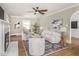 Cozy living room with a ceiling fan, fireplace, and comfortable seating at 4455 Central Ave, Indianapolis, IN 46205