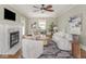 Bright living room featuring a fireplace, ceiling fan, and stylish furniture at 4455 Central Ave, Indianapolis, IN 46205